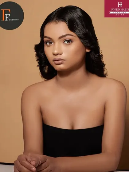 A beautiful shot from a portfolio shoot, featuring vintage-inspired hair waves and soft, natural makeup.