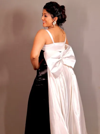 A back view of the gown, showing the beautiful bow and the sophisticated updo.