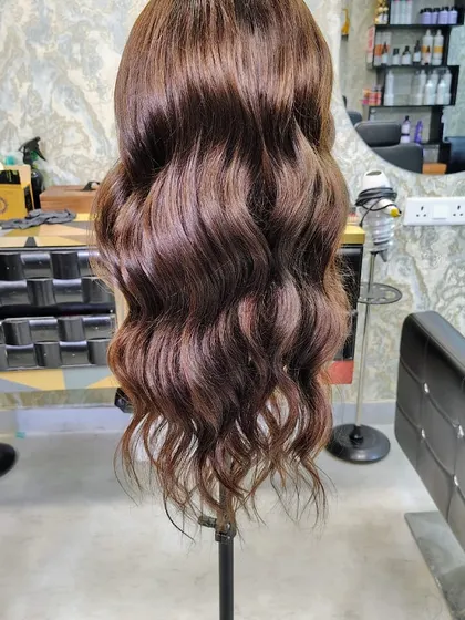 We believe hairpieces should be as fun and stylish as you are. This custom-colored and styled wavy wig shows the beautiful dimension and life our 100% human hair pieces have. You can style them just like your own.