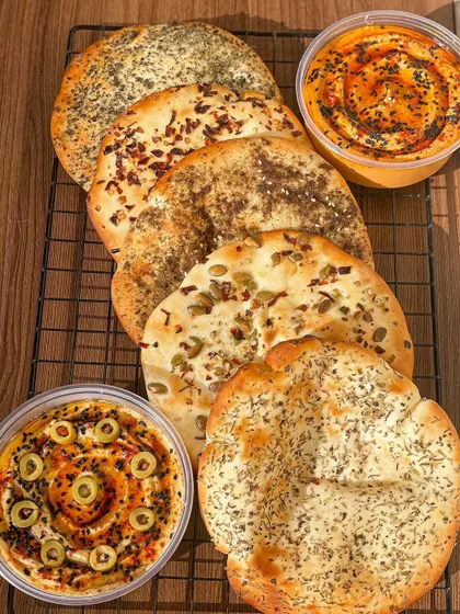 A beautiful spread of my assorted pita breads and hummus dips, perfect for a healthy and flavorful party platter.