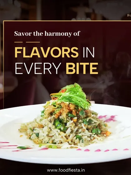 A perfectly plated mound of savory fried rice, garnished with fresh greens. This is a staple from my Oriental cuisine selection, loved for its comforting and delicious flavors.