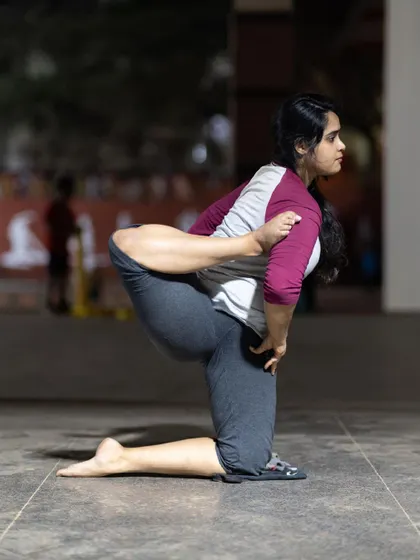 Another angle of this challenging balance, showing the concentration required. I'll help you find the right alignment and engagement to hold poses you thought were impossible.