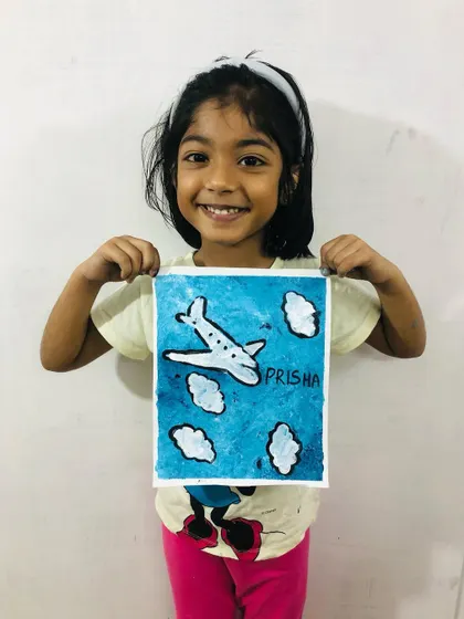 Prisha, from our 5-7 year old group, with her fantastic airplane painting. We teach basic composition and painting techniques in a way that's easy for young children to understand.