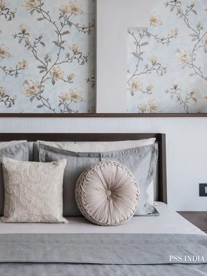 Styling throw pillows is an art. Here, I mixed sizes, textures, and patterns within a cohesive color palette to make the bed look polished and inviting, demonstrating how small details can have a big impact.