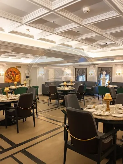 The main dining hall of Begeterre, showcasing the variety of seating we created. Notice the mix of armchair styles and plush sofas, all designed to offer comfort while enhancing the restaurant's regal, museum-like atmosphere.