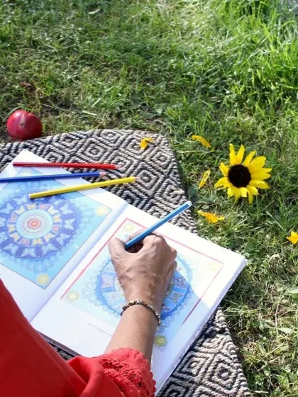 Mindful coloring of a mandala in an apricot orchard in Ladakh. Creative expression is a wonderful form of meditation, allowing the mind to focus and relax.