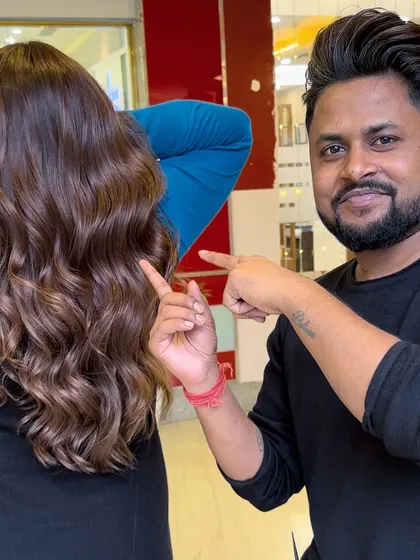 Calling all brunettes. This image shows a beautiful rose gold tint on brunette hair, a trendy and unique option.