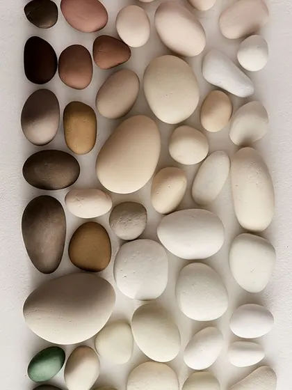 A beautiful and calming color palette inspired by natural pebbles. The gradient of earthy, neutral tones is perfect for creating serene and grounded interior spaces.