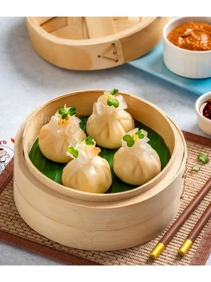 Prawn and chive dumplings in a bamboo steamer, ready to be served.