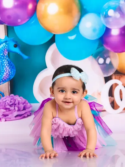 Crawling through her ocean kingdom. This photo captures the sweet and curious nature of a baby exploring our mermaid-themed set.