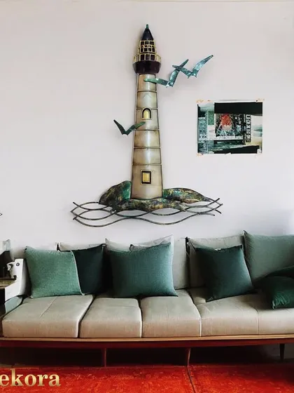 Our lighthouse sculpture is a detailed and artistic piece that tells a story.