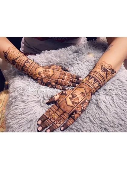 A full view of both hands with the traditional housewarming mehendi design.