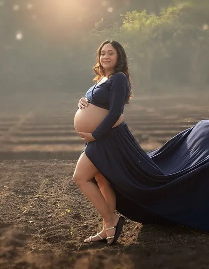 The movement of a flowing gown in an open field adds such a beautiful, dynamic element to a maternity portrait. This shot captures a sense of freedom, beauty, and anticipation.