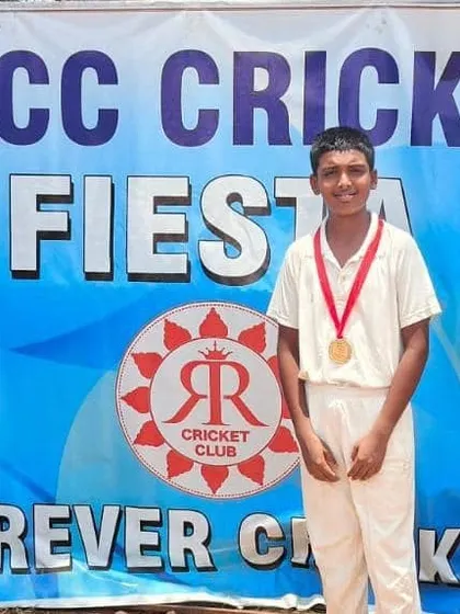 Keerthan proudly displaying his medal.