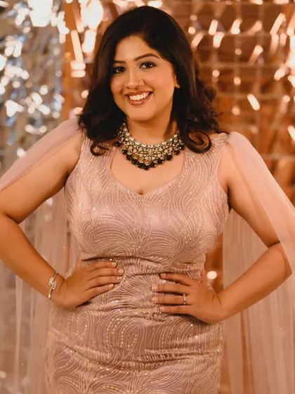 A close-up of the party glam look. You can see the shimmer on the eyes and the glowing highlight on the cheeks.