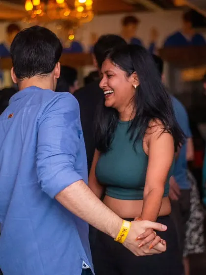 A moment of pure laughter and joy on the dance floor.