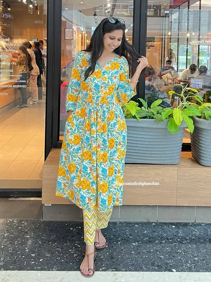 This vibrant yellow floral kurta set is a cheerful choice, perfect for celebrating the joy and energy of any festival.
