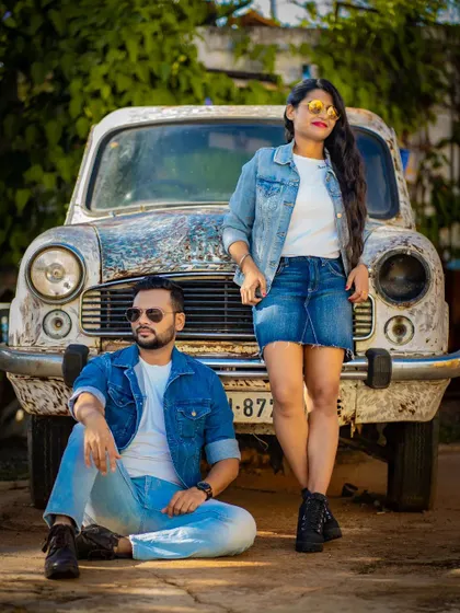 Another angle from the vintage car pre-wedding shoot, showcasing a relaxed and stylish pose from the couple.