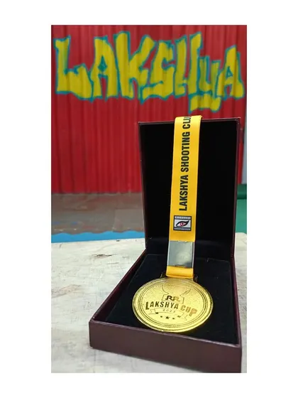 The gold medal for the RR Lakshya Cup, a prize earned through skill and dedication.