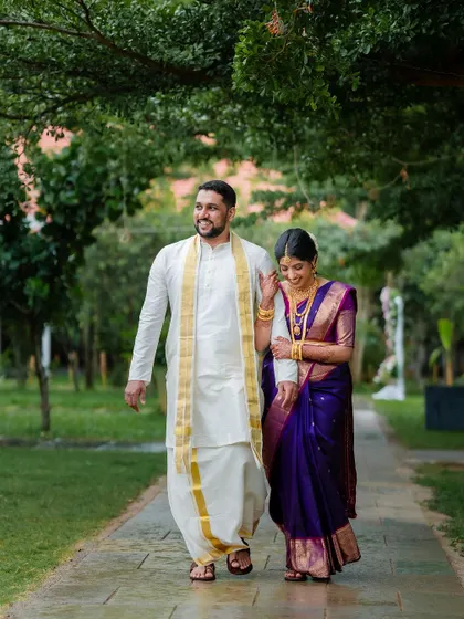 A romantic stroll in the rain. We embrace every element of the wedding day, even a little monsoon magic, to create unique and memorable couple portraits.