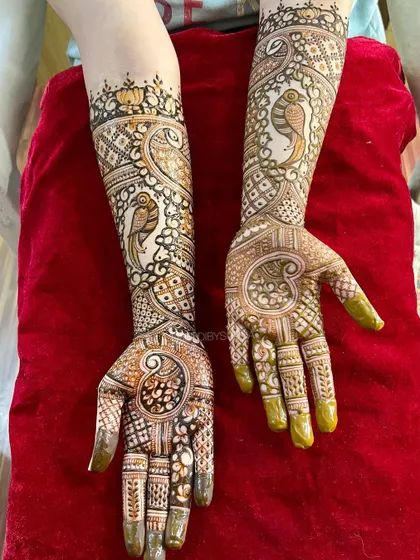 A lovely engagement design featuring parrots and paisleys, a unique take on traditional bird motifs.