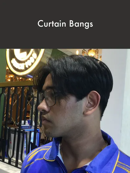 Curtain Bangs are a stylish, softer option for men's hair. This look frames the face and offers a relaxed yet put-together vibe, showcasing my team's ability to handle diverse and trending hairstyles.