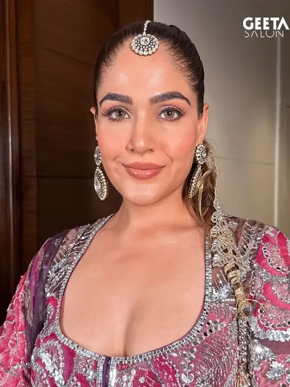 A confident and beautiful bride ready for her big day. Her makeup is flawless from every angle, with a focus on luminous skin and defined eyes, ensuring she is picture-perfect.