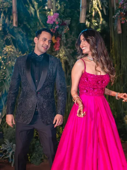 The playful smiles and eye contact between this couple during their performance highlight the fun and joy of dancing together.