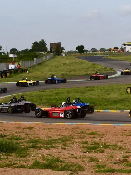 Our car, number 21, leading a group of competitors through a sweeping corner.