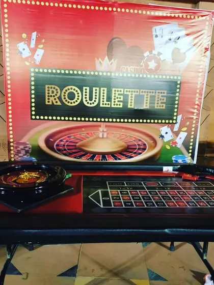 Our Roulette table setup is always a crowd-pleaser. We provide the complete game set, including the wheel and a professionally designed table, along with a bold backdrop to enhance the casino theme.