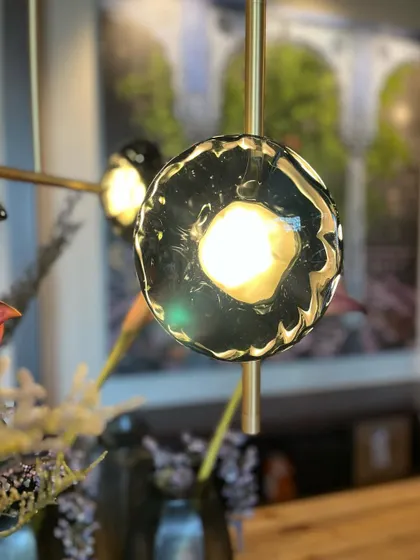 A beautiful portrait shot of a single Ceto glass shade, capturing the depth and texture created by the optic glass blowing technique.