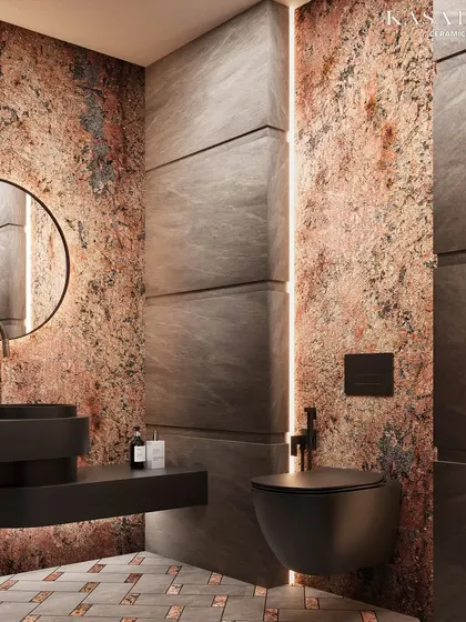 A wider view of the Red Ruptura stone bathroom, showcasing the interplay of textures and light. The raw, earthy feel of the stone wall is balanced by the clean lines of the modern fixtures and the structured paneling. The vertical LED strip lighting accentuates the depth of the wall panels, adding to the room's dramatic effect.