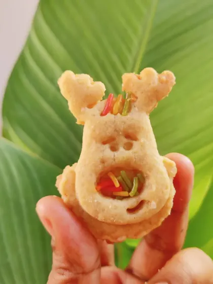 A close-up of a finished reindeer cookie. The custom 3D printed cutter allowed for this unique shape, complete with antlers and a face, which would be hard to find in a store.