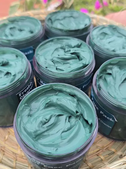 A close-up shot showing the creamy swirls in a pot of my Charcoal Face Pack.