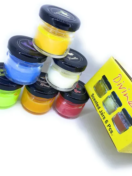 My scented jars are easy to stack and store. Here you can see a playful arrangement next to the "Divine" gift box they come in, ready for gifting.