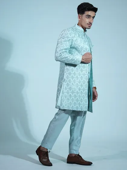 A full-length shot of the light blue sherwani, showing off its modern, tailored fit.