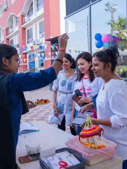 Welcoming guests with a traditional tilak for our Holi celebration. I love incorporating cultural traditions to make our festive events authentic and special.