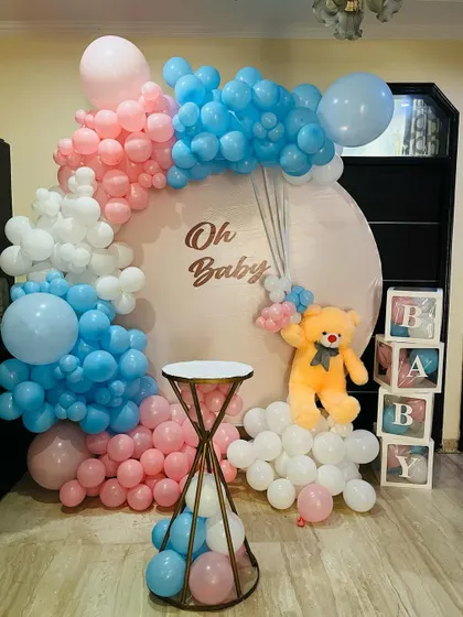 This popular "Oh Baby" theme combines a teddy bear with pink and blue balloons. It's a sweet and modern choice for any baby shower and provides a beautiful background for photos.