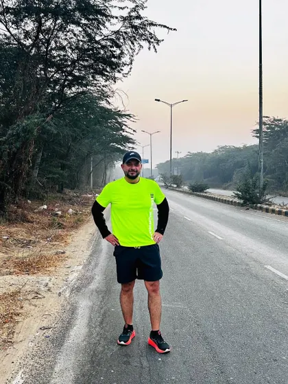 A runner from our tribe, standing strong on the road. We build the confidence to own any route.