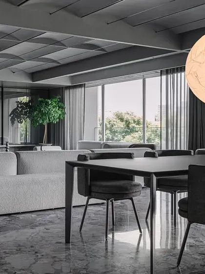 A wide shot connecting the living and dining areas, demonstrating our concept of creating a dialogue between spaces to make activities like dining less isolated.