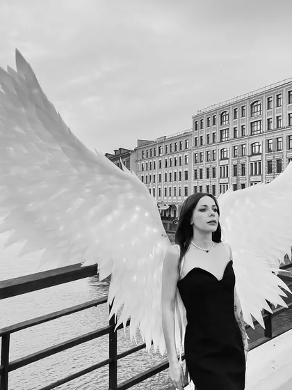 A black and white photo from our angel wings shoot in Moscow. The wings look so dramatic against the city backdrop.