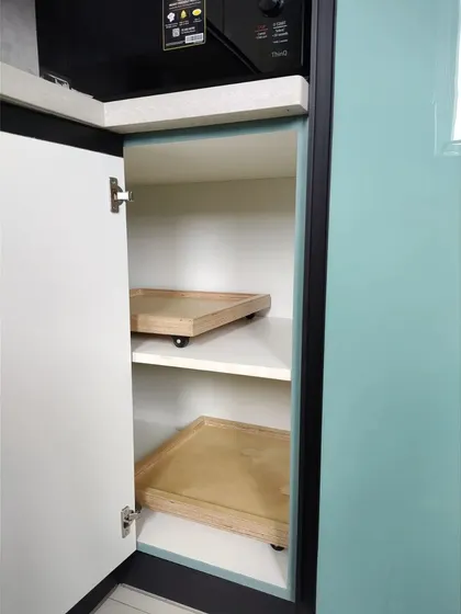 A clever storage solution for small appliances. This cabinet features pull-out trays on wheels, making it easy to access items stored at the back without having to unload everything in front.