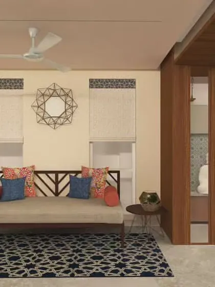 Here, I've embraced a contemporary Indian aesthetic. The neutral walls and floors provide a calm backdrop for vibrant pops of color in the cushions and a patterned rug. The wooden daybed adds a traditional touch to the modern space.