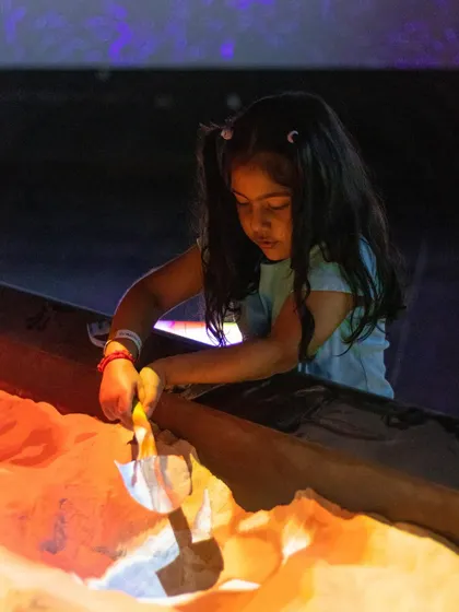 Digging for treasure in the illusion sand, where projections change based on the sand's height and shape.