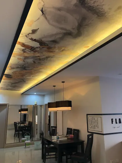 A view from the other end of the hall, showing how the wallpapered ceiling defines the entire dining and entryway space.