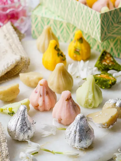 A colorful assortment of modaks for a Ganesh Chaturthi shoot. We use bright, clean lighting to make these traditional sweets look fresh and appealing.