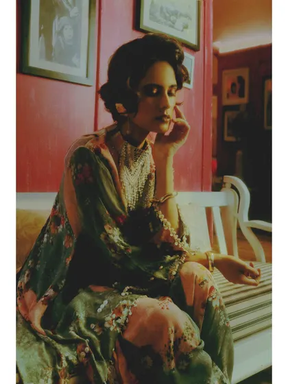 A quiet, seated portrait from "Love in Future Past." The composition and the model's pose evoke a sense of waiting, a key theme in the editorial's exploration of love and time.