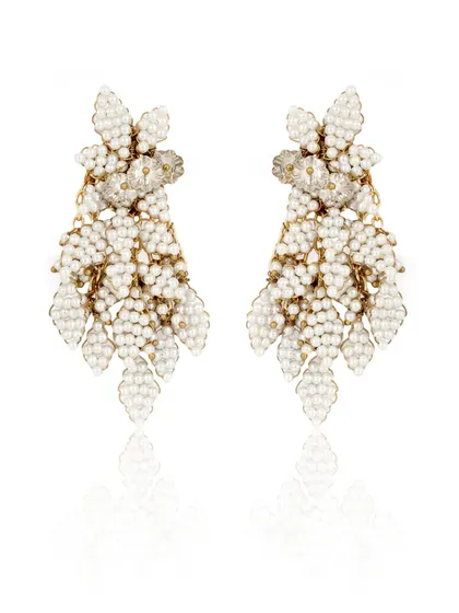 Modernity in every detail. These white beaded leaf-motif earrings are designed for the woman of today.