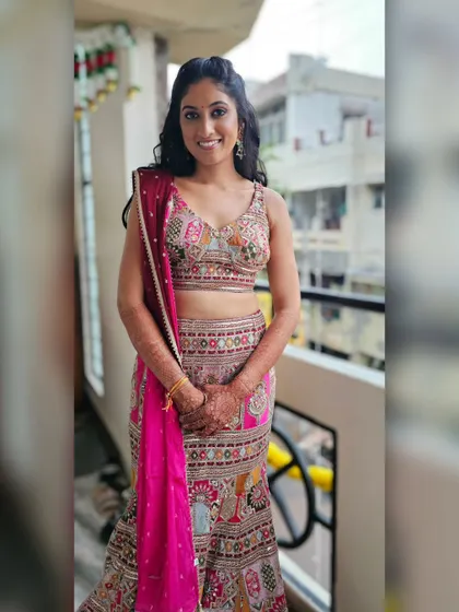 A full-length shot of Sanjana looking vibrant and happy at her Mehendi ceremony.