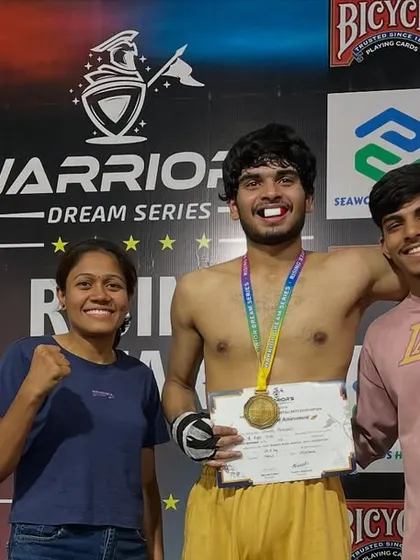 Celebrating a win with teammates, including female coach Nayan. Our club is a supportive family for all fighters.
